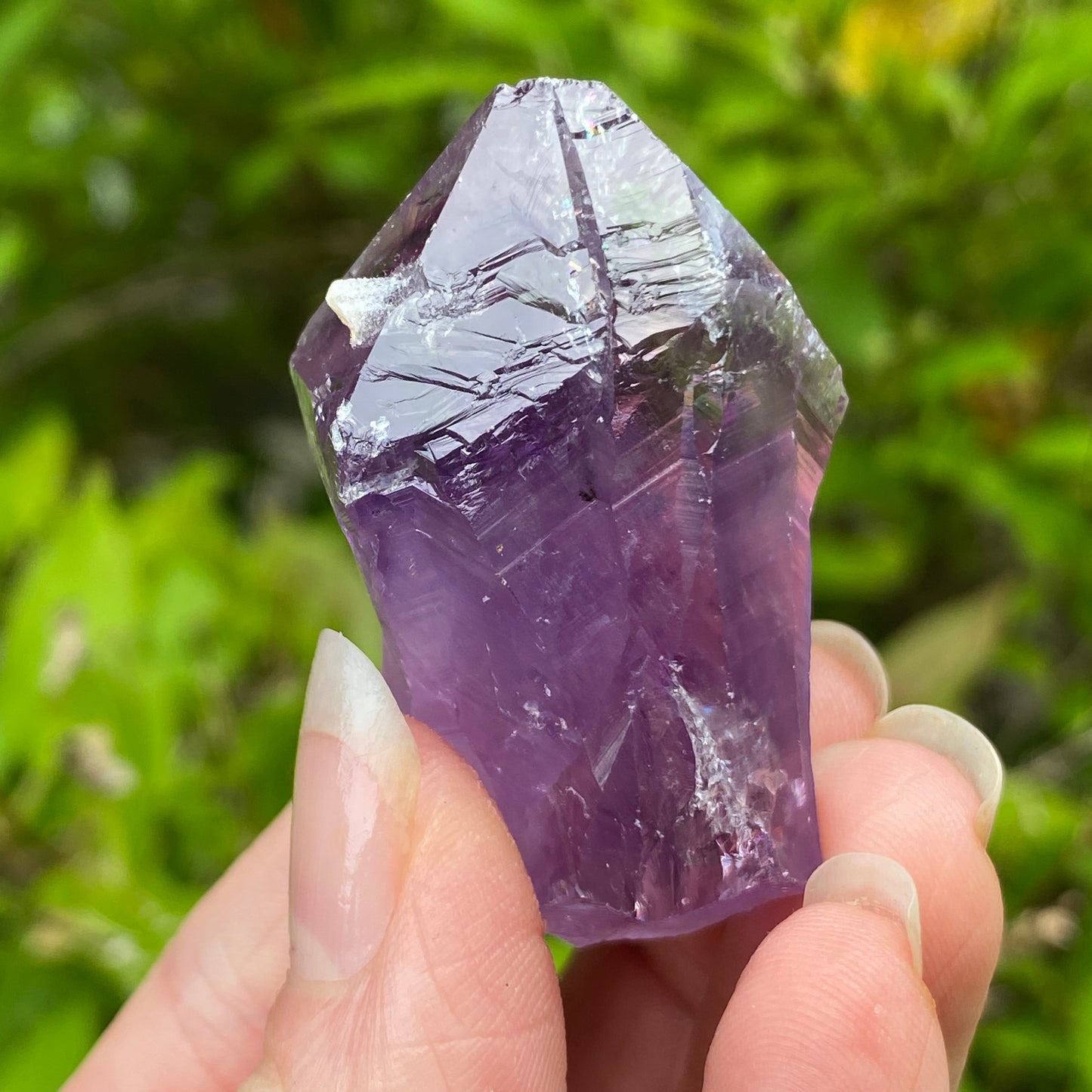 Amethyst Point with tiny Calcite
