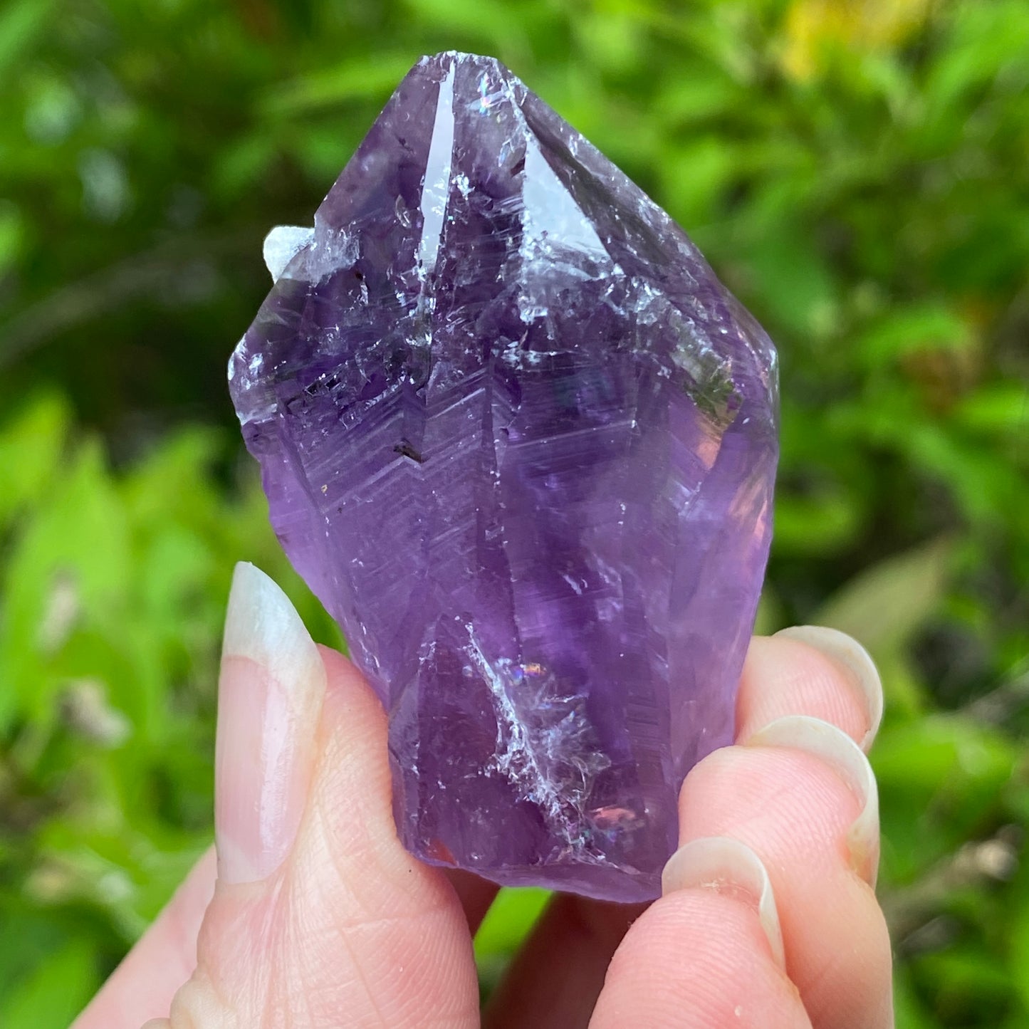 Amethyst Point with tiny Calcite