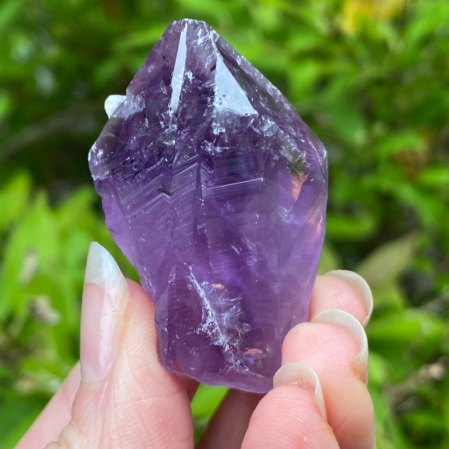 Amethyst Point with tiny Calcite