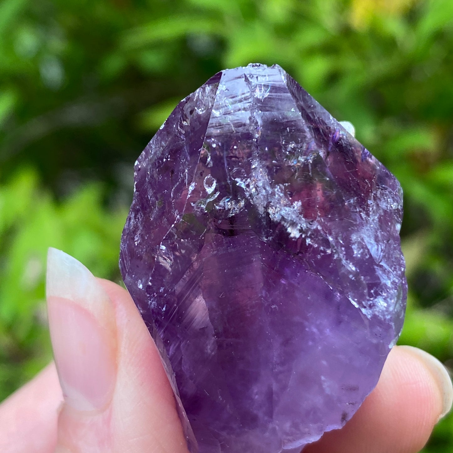 Amethyst Point with tiny Calcite