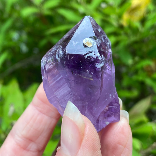 Amethyst Point with tiny Calcite