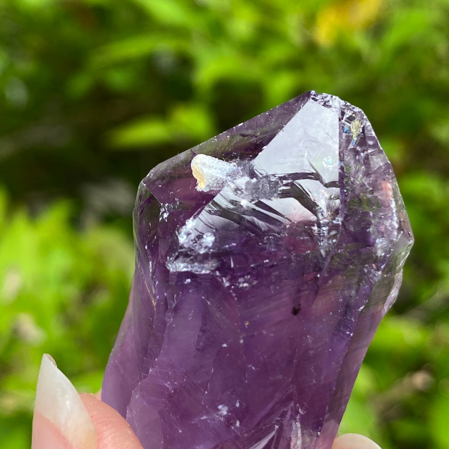 Amethyst Point with tiny Calcite