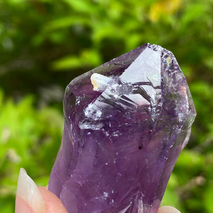 Amethyst Point with tiny Calcite